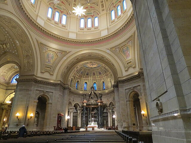 Interior of massive cathedral with a large dome